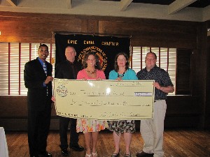 At the June luncheon, Lockridge (l) presents $2,600 in awards to local area teachers Dan McPhail (2nd from l), South Lewis High School; Lisa Gentile (c), Proctor High School; Anne Huntress (2nd from r), South Lewis High School; and Michael Comet, South Lewis High School. 